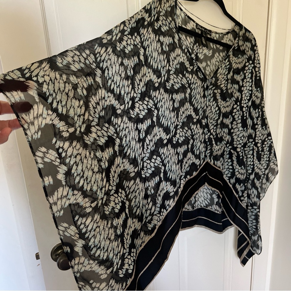 100% silk asymmetrical silk top in black pattern with covered buttons